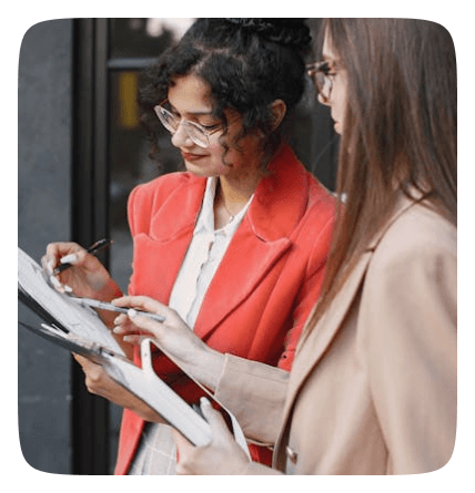 Two women looking at tablet
